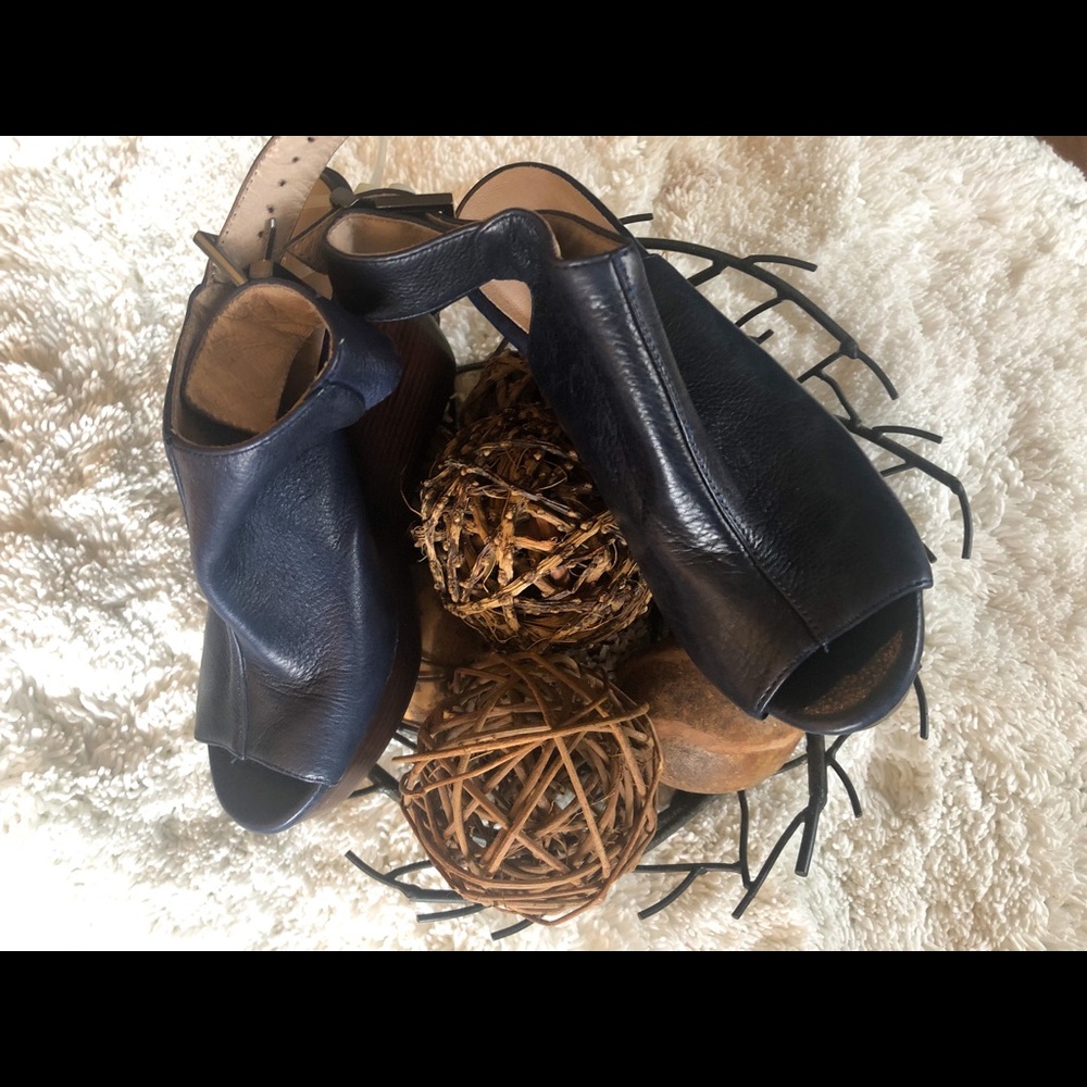 Navy blue medium wedge leather upper with open toe and back